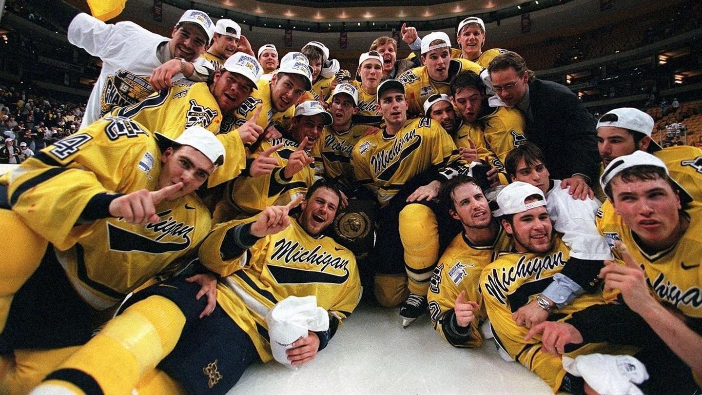The Michigan Wolverines celebrate winning the 1998 men's hockey national championship