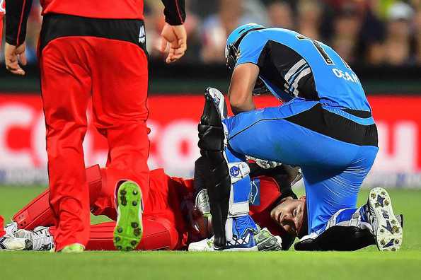 Peter Nevill was hit on the jaw after the bat flew off Brad Hodge's hand.