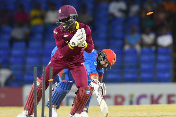 Chadwick Walton whipped off the bails to find Mohammad Nabi short of the crease as Afghanistan slumped to 34 for four