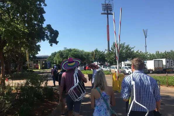 "Fans are allowed to carry their own deck chairs, umbrellas and sun screen" says one signboard.