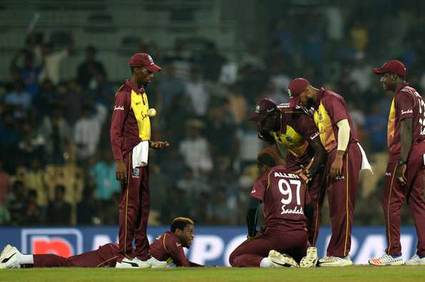 A distraught Windies team after their narrow loss in the final T20I. A distraught Windies team after their narrow loss in the final T20I.