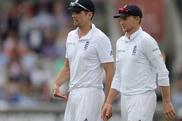 Alastair Cook signalling his decision that England will bat