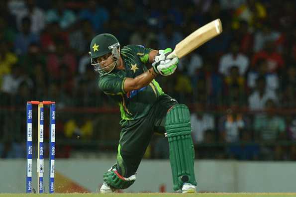 Umar Akmal plays a shot during the first Twenty20 international against Sri Lanka.