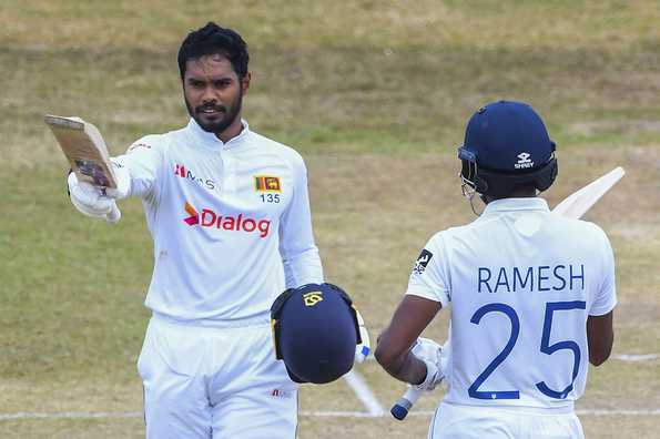 Dhananjaya de Silva celebrates getting to his century. Dhananjaya de Silva celebrates getting to his century.