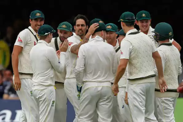 Australia?s Mitchell Johnson (4L) celebrates taking the wicket of England?s Joe Root for 1 run during play on the second day of the second Ashes cricket test match at Lord's cricket ground in London, on July 17, 2015