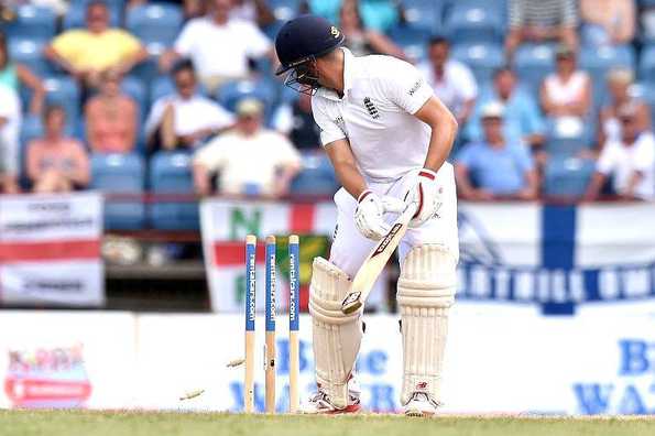 Jonathan Trott dragged onto the stumps during England's second over of their successful chase.