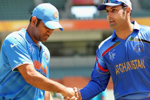India captain MS Dhoni shakes hands with Afghanistan skipper Mohammad Nabi before the toss. India captain MS Dhoni shakes hands with Afghanistan skipper Mohammad Nabi before the toss.
