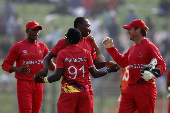 Zimbabwe cricketers celebrate after the dismissal of unseen Netherlands batsman Michael Swart. Zimbabwe cricketers celebrate after the dismissal of unseen Netherlands batsman Michael Swart.
