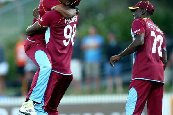 HAMILTON, NEW ZEALAND - JANUARY 08: Jason Holderof the West Indies (C) celebrates his runout of Kyle Mills of New Zealand during game five of the One Day International Series between New Zealand and the West Indies at Seddon Park on January 8, 2014 in Hamilton, New Zealand. HAMILTON, NEW ZEALAND - JANUARY 08: Jason Holderof the West Indies (C) celebrates his runout of Kyle Mills of New Zealand during game five of the One Day International Series between New Zealand and the West Indies at Seddon Park on January 8, 2014 in Hamilton, New Zealand.