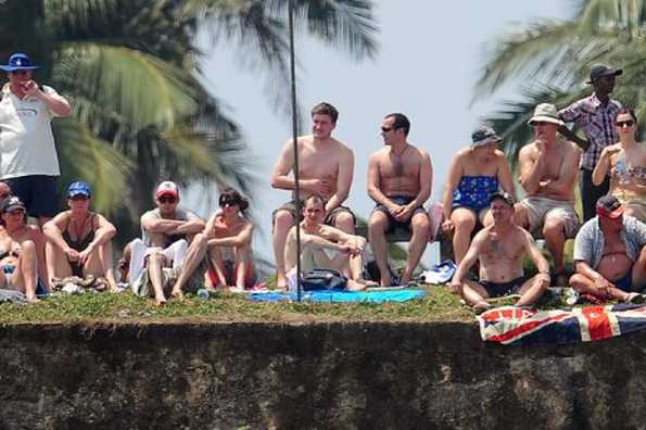 England cricket fans watch the first day of the opening Test match between Sri Lanka and England from the top of the 14th century Dutch fort near the Galle International Stadium in Galle on Monday England cricket fans watch the first day of the opening Test match between Sri Lanka and England from the top of the 14th century Dutch fort near the Galle International Stadium in Galle on Monday