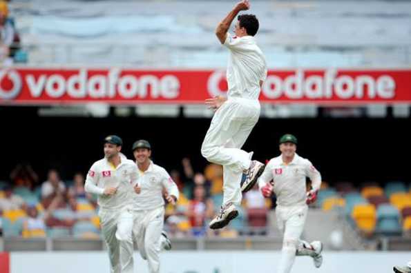 Mitchell Starc (2R) will not forget his first day as an Australian Test cricketer Thursday, as he got his baggy green cap from legend Richie Benaud and took two New Zealand wickets at the Gabba. Mitchell Starc (2R) will not forget his first day as an Australian Test cricketer Thursday, as he got his baggy green cap from legend Richie Benaud and took two New Zealand wickets at the Gabba.