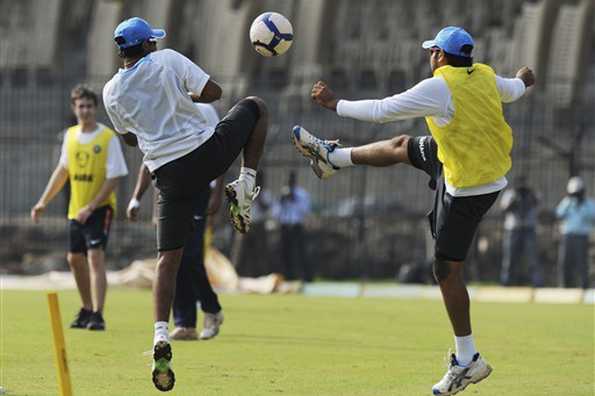 The Indian team members play a game of football on the eve of the match.