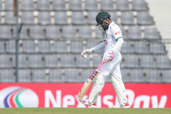 Mushfiqur Rahim walks back after being dismissed
