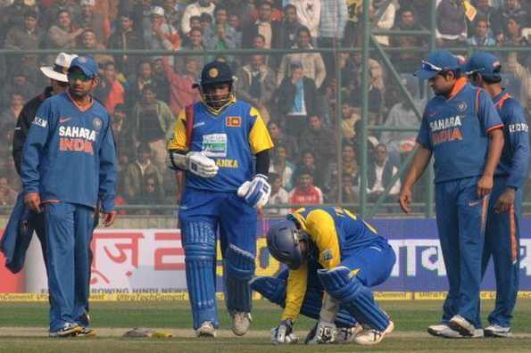 Dilshan goes down after being hit by a rising delivery on the Kotla pitch. Dilshan goes down after being hit by a rising delivery on the Kotla pitch.