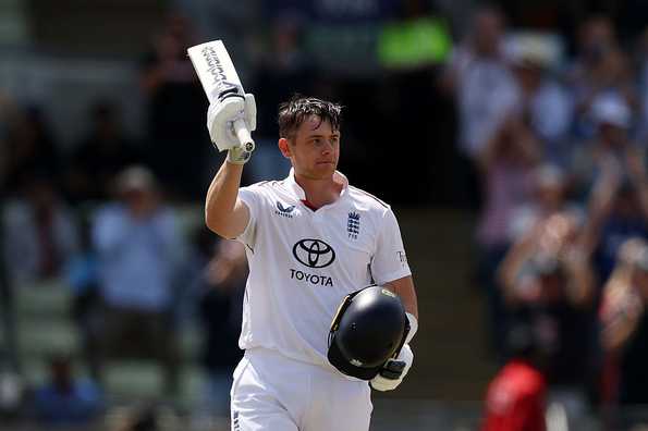 Jamie Smith raises his bat after reaching his 100 Jamie Smith raises his bat after reaching his 100