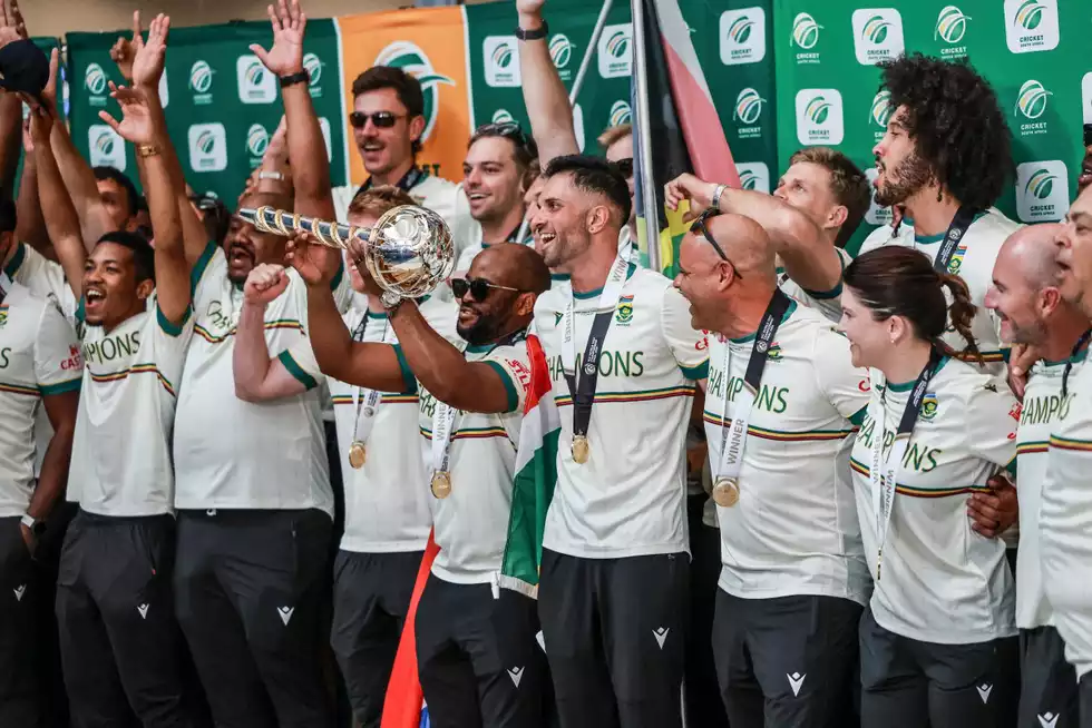 The victorious squad were met at the airport by thousands of supporters before the party moved to CSA's offices, where the red carpet was duly laid out The victorious squad were met at the airport by thousands of supporters before the party moved to CSA's offices, where the red carpet was duly laid out